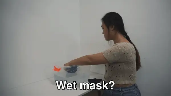 Animation: checking the mask is clean and dry before wearing